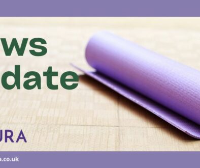 Text: News Update Image of a rolled up purple yoga mat on a cork floor